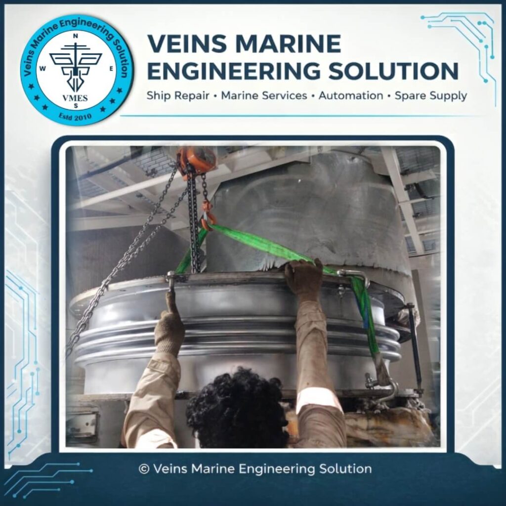 VMES technical team guiding new EGCS expansion joint bellows into precise concentric flange alignment during bellows replacement onboard MV SOTIRIA at Chattogram Anchorage