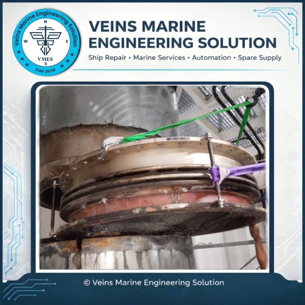 Old deteriorated EGCS expansion joint bellows being removed using chain block and rigging slings during EGCS bellows replacement onboard MV SOTIRIA by VMES