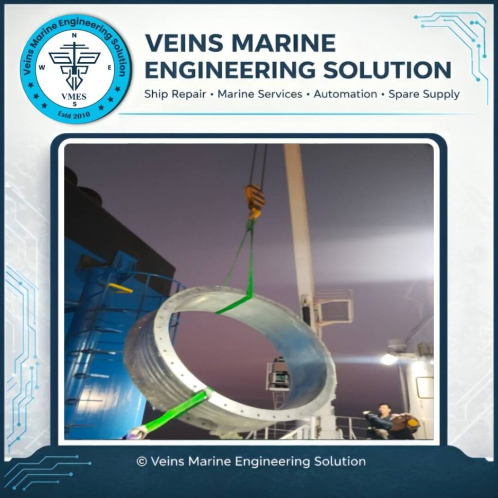 Newly fabricated EGCS expansion joint bellows being hoisted into installation position using ship crane during EGCS bellows replacement onboard MV SOTIRIA at Chattogram Anchorage