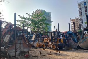 VMES workshop yard wheel loaders parked marine equipment Chattogram